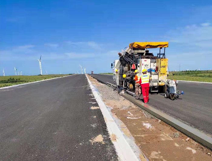 NC1300 slip form paver in Zhangjiakou Shangyi Noble Highway hard shoulder slip form construction project